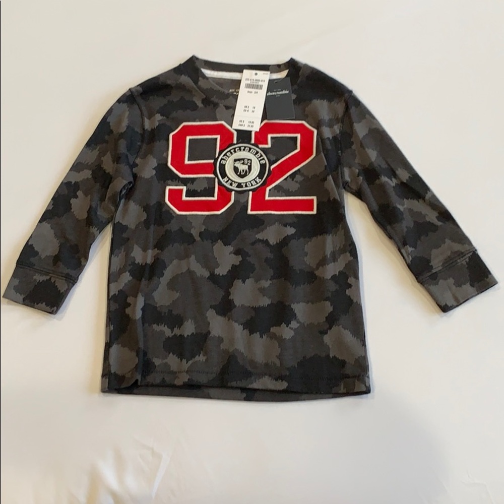 New. Camouflage look. Black and gray with red 92.